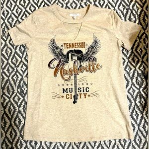 Cute tee with cut out in neckline.